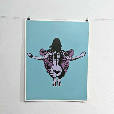 stencil painting nude woman superimposed over a jaguar face