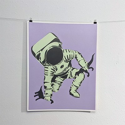 stencil painting astronaut holding dinosaurs