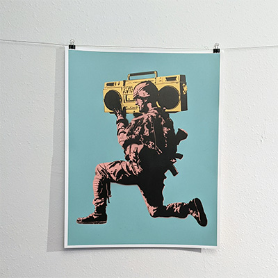 stencil painting soldier with a boombox